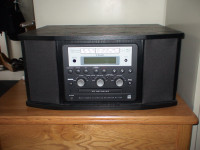 Teac.  Converts albums and Cassettes to CD's.  AM/FM