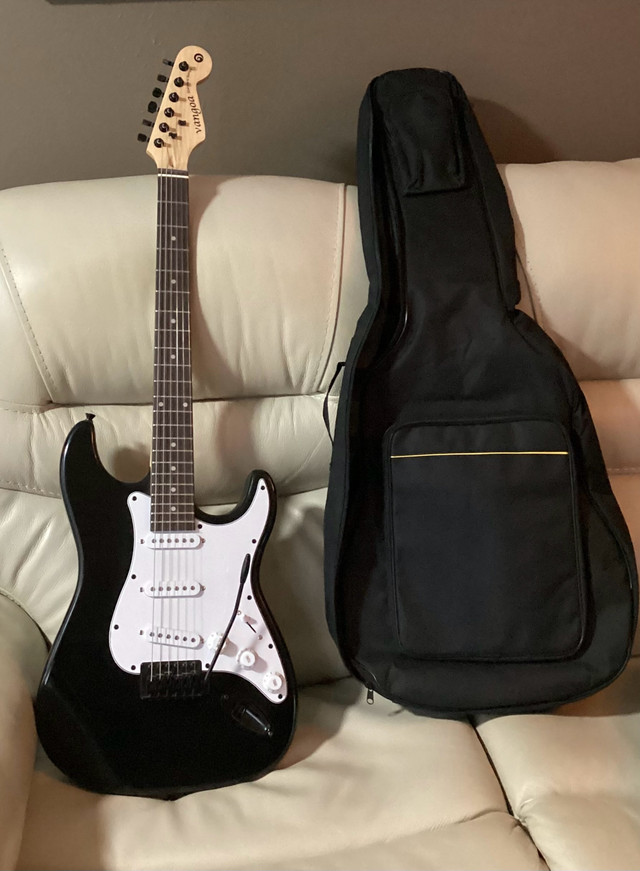 VANGOA STRAT STYLE GUITAR -NEW with Gig Bag and accessories in Guitars in Grand Bend