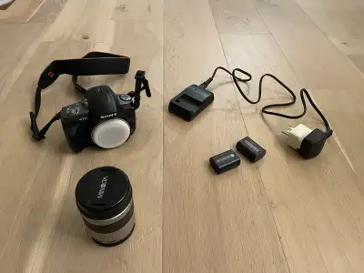 This is a Sony a330 DSLR camera body with a Minolta lens for sale. Comes with two batteries, charger...