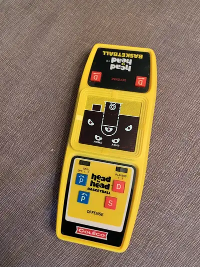 Vintage Coleco Head To Head Basketball Handheld Game. Working and comes with new battery.
