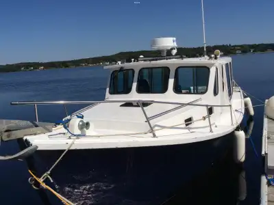 Built in Murray River, PEI. Original fiberglass over wood construction, including superstructure. Ex...
