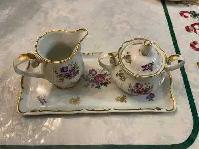 This beautiful Reutter cream and sugar set from the German Democratic Republic features delicate flo...