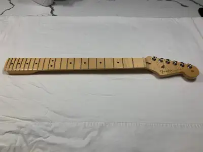 Its a Fender Custom Shop Neck. Has a 9.5 radius came off my Custom Classic Strat.. The neck has a C...
