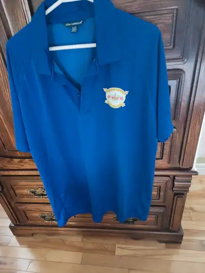 This is a blue Coal Harbour golf shirt, perfect for a casual day on the course or just showing your...
