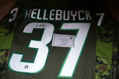 Connor Hellebuyck Autographed Winnipeg Jets Camo Jersey, View more
