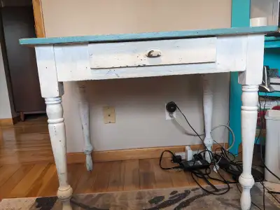 Nice solid vintage table with one drawer. Lots of character, has been painted more than once (not by...