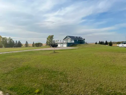 shop/yard/house/storage package! 5000 ft2 heated shop, 16'x24' oh + 2- 12'14'oh, office, laundry hoo...