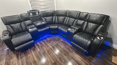 Upgrade your home theatre with this luxurious, used black leather sectional sofa, featuring power re...