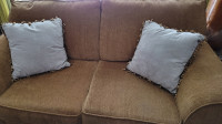 6 Grey Throw cushions with Brown Tassels.
