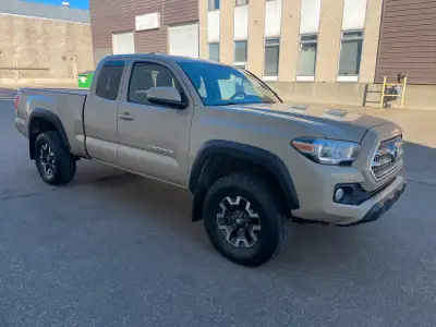 Selling my 2016 Toyota Tacoma Access Cab. Quicksand Tan Color with black cloth interior. V6 4x4 w/ m...