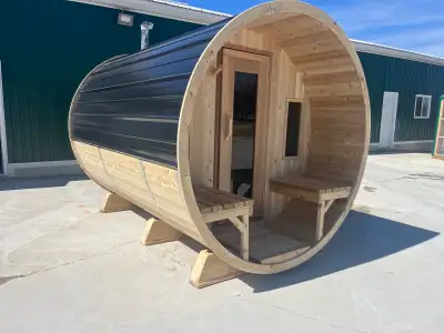 Brand new 7’x10’ Barrel Sauna. Half moon glass in the back. 8’ of sauna with a 2’ porch. Wood Fired....