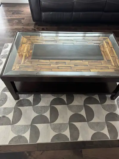 Wooden coffee table with glass top. Very good condition Firm on price