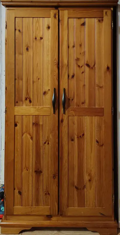 *If ad is posted - it is available. Varnished pine wood closet/wardrobe with hinged doors. No MDF, p...