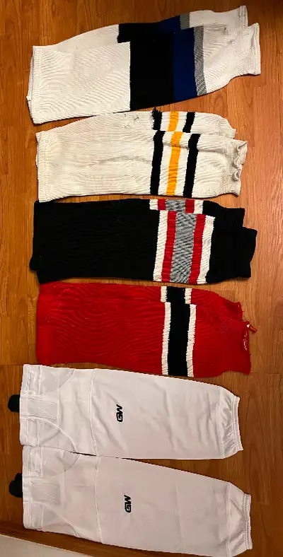 From left to right: GW White practice socks: only used once $15 Red & black: good condition $10 each...