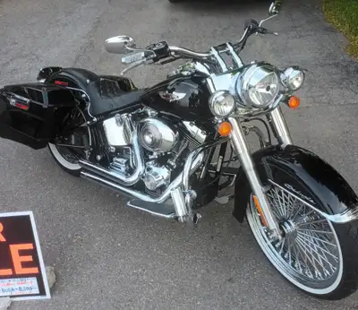 For sale , no trades thanks,,06'Harley Deluxe,, Very clean well cared for and maintained. King spoke...
