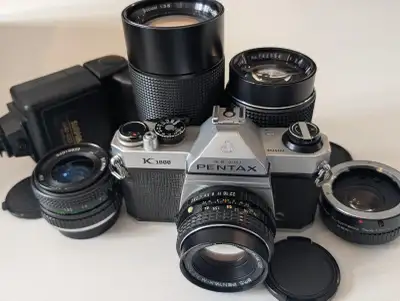 Vintage Pentax K1000 camera with 4 prime lenses and accessories, View more