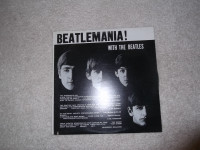 Beatlemania!  With the Beatles vinyl record