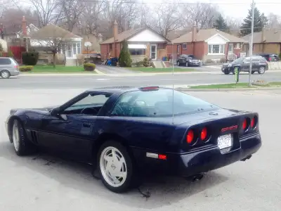 1988 Corvette dark blue with 2 tops. 3 owner car with 141,000 kms. Runs and drives good. Black inter...
