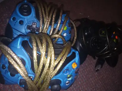 THREE OLD XBOX CONTROLERS, View more