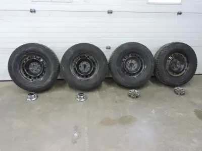 6-Bolt Chev/GMC 1500 steel rims with centre caps and nuts. Tires are Toyo Observe GSI-6LS in P265/70...