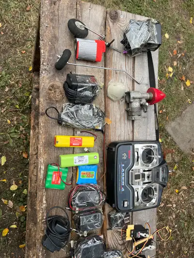 Assortment of old tv airplane parts receiver transmitter motor. Chargers. Make an offer.