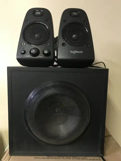 Selling a Logitech Z623 THX Speaker System 2.1 which works and sounds great. The system has knobs to...