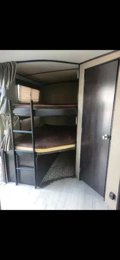 This RV has an insulated underbelly and is good for winters too. It currently sits on a lot in a Por...