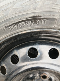 4 Toyo 185 / 65 r15 winter tires on four bolt Nissan Versa rims
