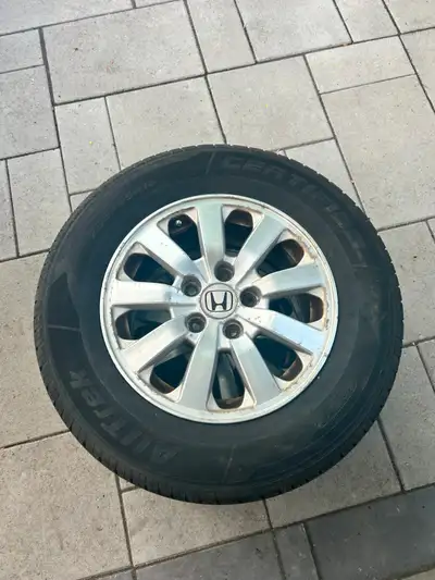 Set of 4 OEM Honda alloy wheels with Motomaster AW Alltrek all-weather tires (235/65R16 103H), alrea...