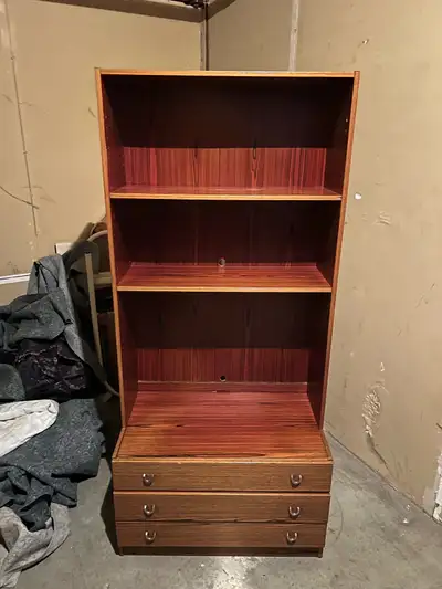 80$ 2.32 feet by 1.19 feet 5.71 feet high Selling a wooden bookshelf with three drawers at the botto...