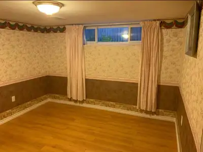 A large, clean, and fully furnished private room is available in the basement of a quiet home near M...