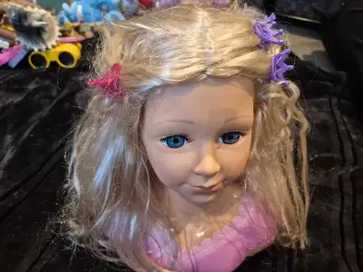 Pretend play hair styling doll. Includes 6 hair clips and small brush. Pickup Richmond Hill.