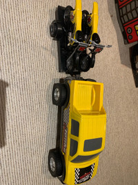 Large tonka truck with 2 dirt bikes