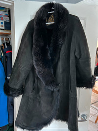 Black shearling flared/cape style winter coat.  Luxury coat