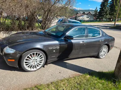 Black Quattroporte. 80,000km. Needs work. 15k$ o.b.o. may take side x side as partial trade comes wi...