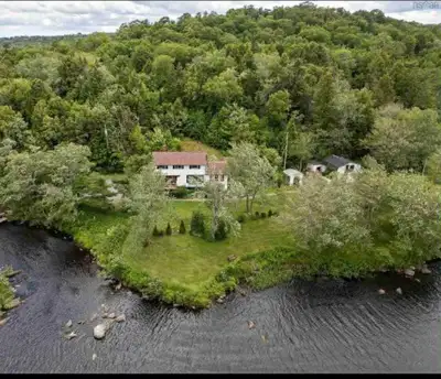 Discover this charming waterfront home, nestled in a serene and picturesque location! This two-story...