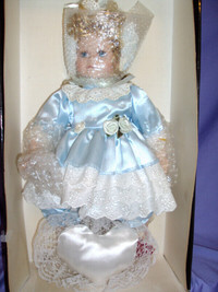 Porcelain Toddler Doll in a Canopy Bed