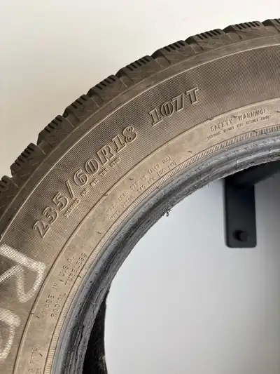 These Goodyear WinterCommand tires in size 235/60R18 107T are reliable winter companions for your ve...