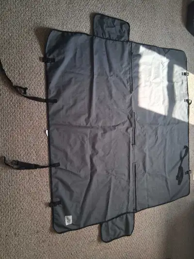 Keep your inflatable boat protected with this gray, water-resistant cover. The cover is in decent co...