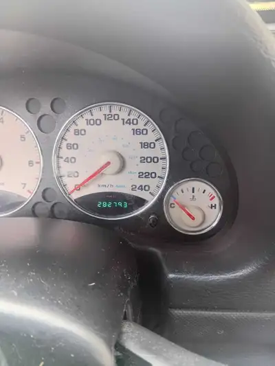 Gold, 4 door, 4X4, new radiator. Reliable. Started all winter. 282,793 miles. Automatic.