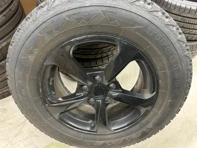 Black VW replicas. Hubcentric and uses factory wheel bolts. Lots of tread on Firestone Winterforce t...