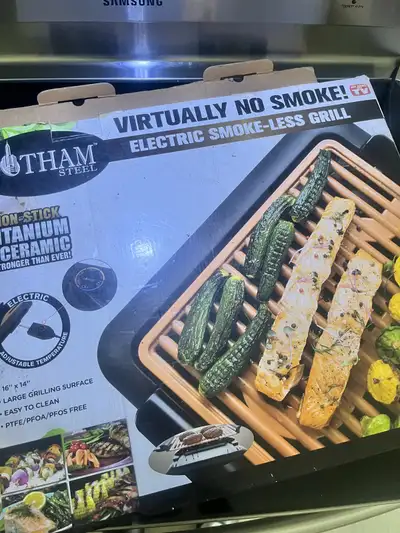 Get restaurant-quality grilled results at home with this Tham Steel Electric Smoke-Less Grill, featu...