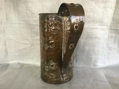 Large English Arts & Crafts beaten copper loop handled vessel with a stylized honesty motif from 189...