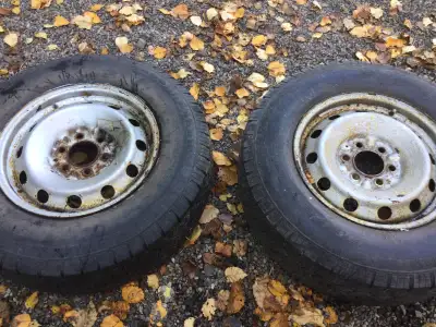 2 tires on steel rims fit f150 . Still some tread . One holds air the other doesnt