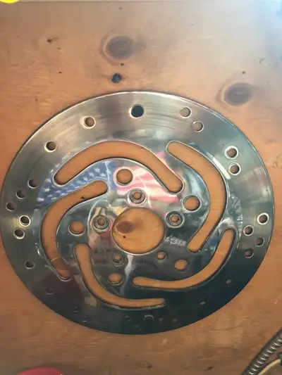 Factory original Harley front rotor. Part #44156-00. Rotor has been polished and used for mock-up an...