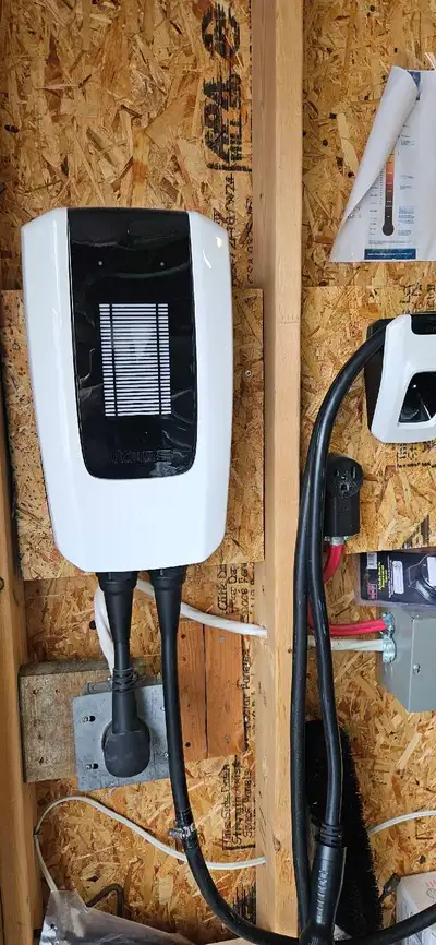Selling a used Level 2 GM car charger for a Chevy Bolt, accompanied by an aluminum alloy winter tire...