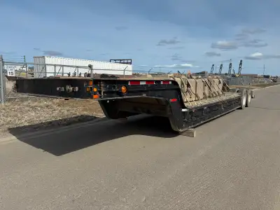 I have an older double drop trailer for sale in good working order. Asking 15000$ Has fresh safety