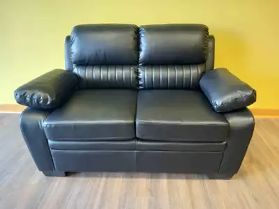 Brand new black leather love seat. Free delivery & sofa disposal, View more