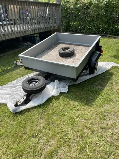 Utility Trailer 4 feet wide x 5 feet long. New Tires and Rims as well as New Lights and Wiring. 2 In...