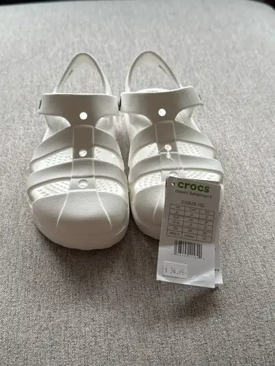 These brand new Crocs Classic Fisherman kids sandals in white are perfect for all your little one's...